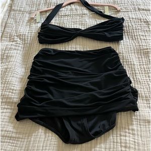 Norma Kamali , OMO swimwear line . It is ruched , can be worn for evening also.